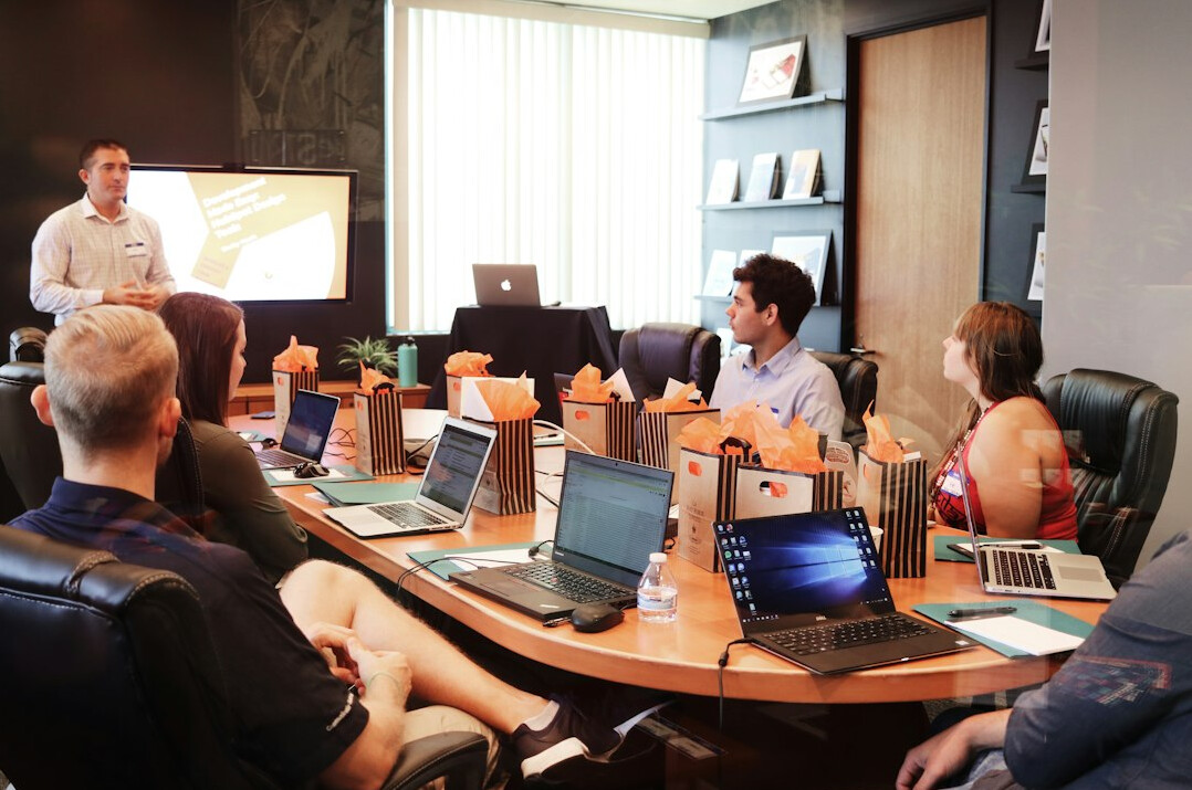 professional presenting in meeting