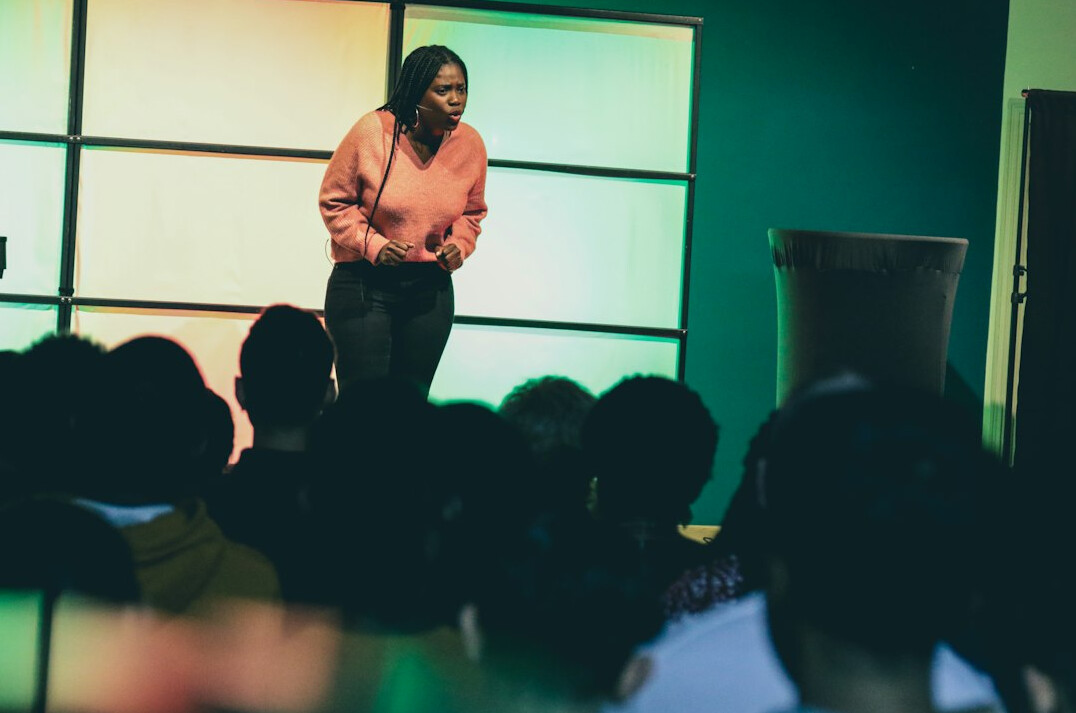 confident speaker on stage