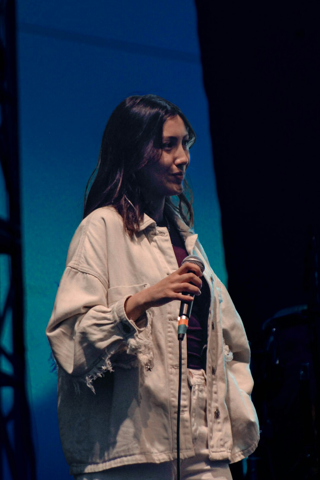 confident person speaking on stage