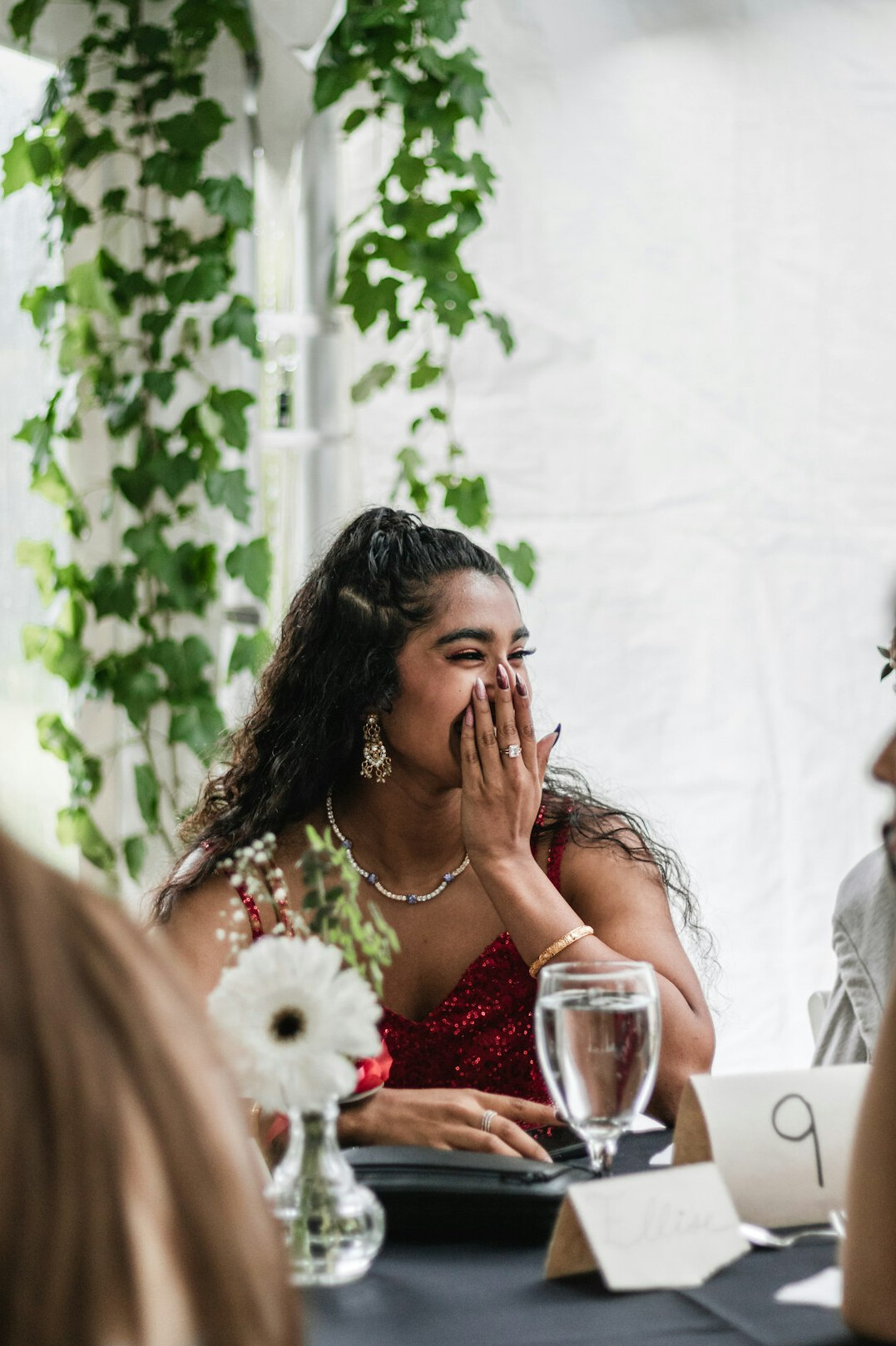 Friends talking and laughing around a table