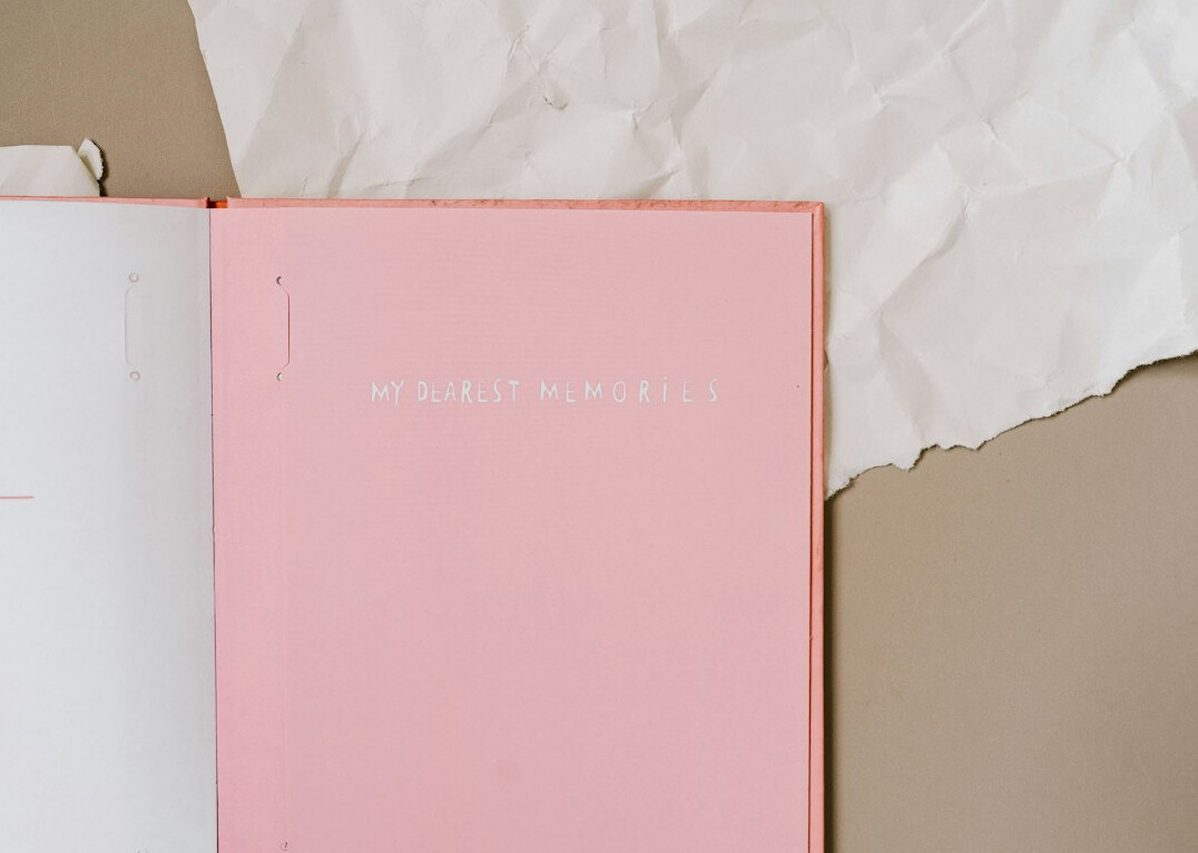 Open notebook with handwritten notes on a desk