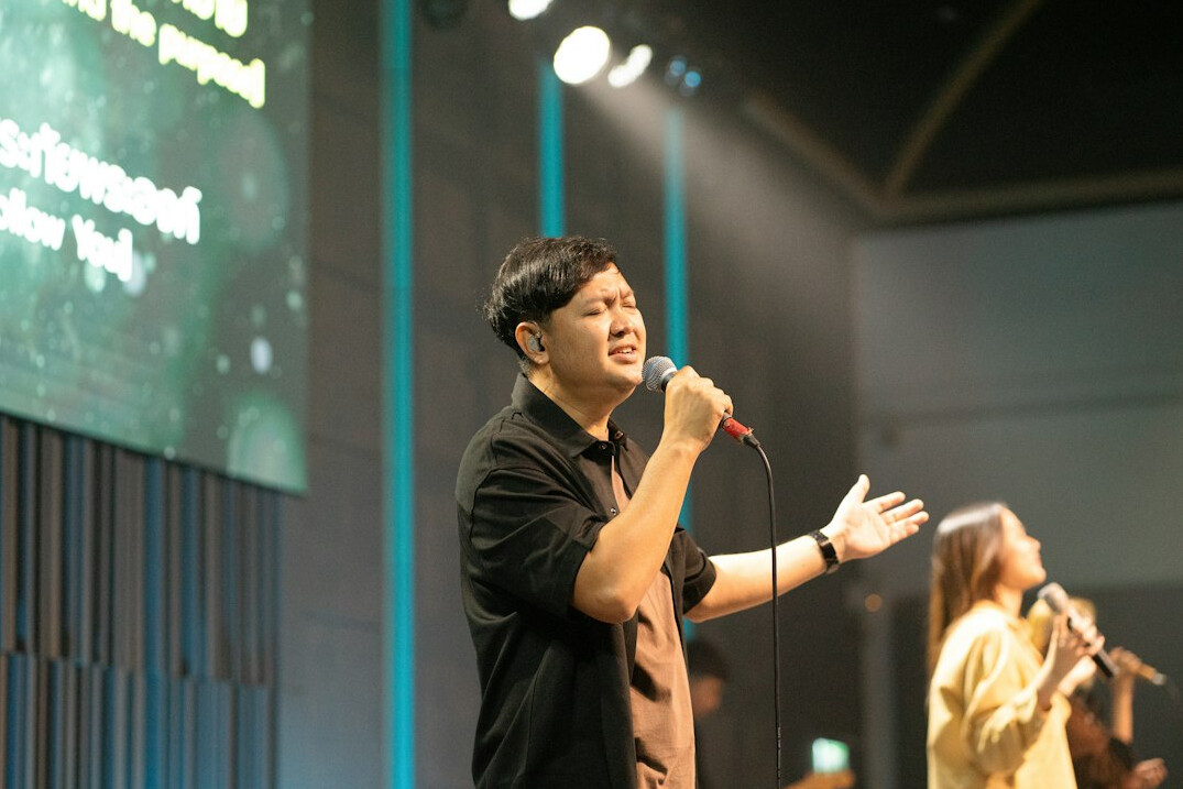 person speaking confidently on stage